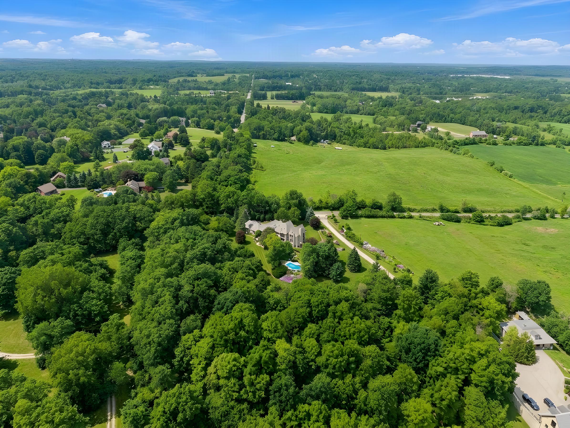 Wide aerial view of the estate within the surrounding countryside